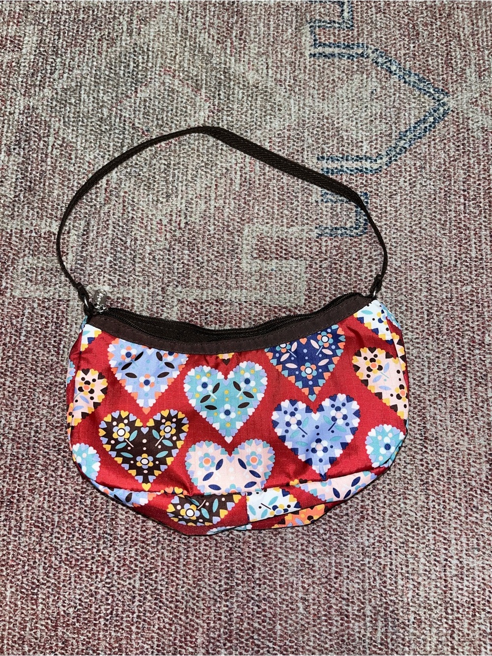 Le sport sac Dutch style heart print mini crescent shoulder bag in like new cond